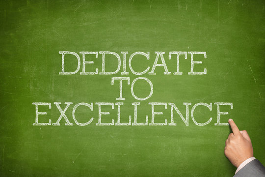 Dedicate to excellence text on blackboard