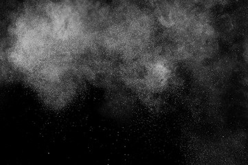abstract white dust explosion  on a black background. abstract white powder. design elements. abstract texture.