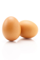 Two eggs isolated on white background