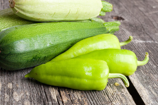 Pepper and Zucchini on wooden background