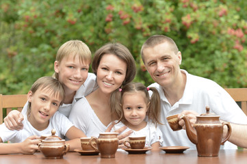 Family eating fruits in summer