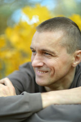 Fototapeta premium happy young man in autumn park 
