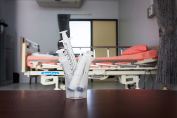 Medical syringes in patient Rooms background