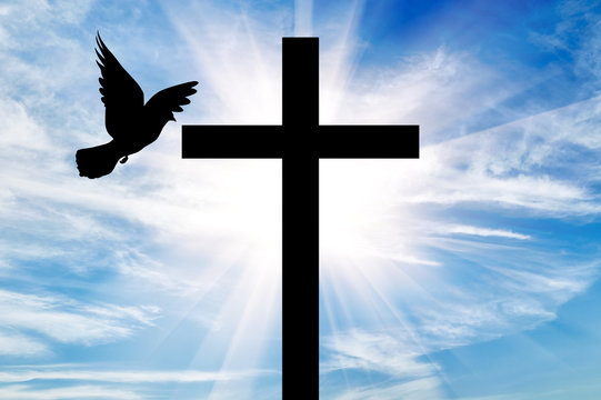 Silhouette of a cross and dove