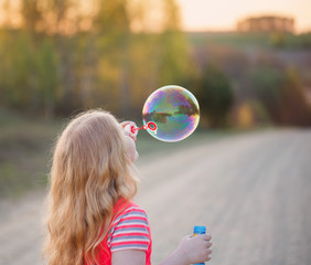 happy girl with soap bubbles