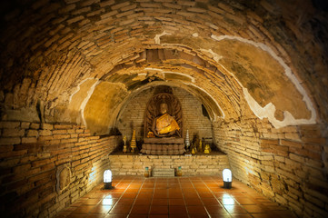 Naklejka premium Buddha statue in one of the underground tunnels at Wat Umong, Chiang Mai, Thailand