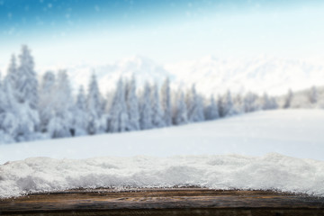 Winter snowy background with wooden planks