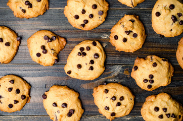 Homemade chocolate chip cookies on wooden background