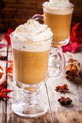 pumpkin latte with whipped cream in a glass jar