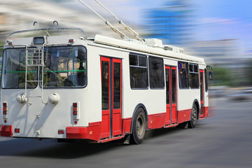 Plakat trolleybus goes on the city