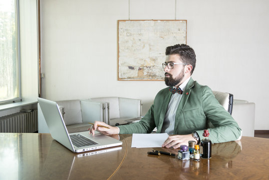 hipster on his office