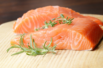 Raw salmon on cutting board