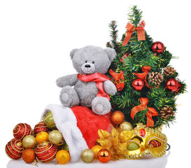 composition with teddy bear christmas tree and santa claus bag