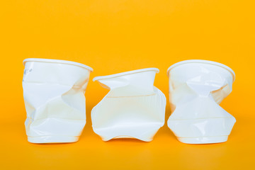 Plastic cups into the garbage