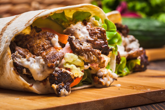 Tasty fresh wrap sandwich with beef and vegetables