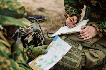 radio operator taking notes and radio