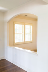 Shutters Through Arch