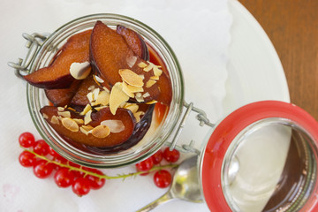 plum dessert with yoghurt and roasted almonds