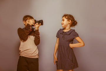 Boy teenager European appearance photographs teen  girl on a gra © maxximmm