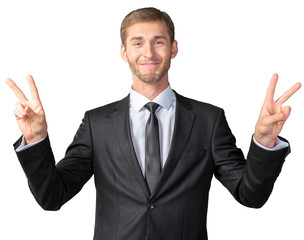 Businessman showing victory sign
