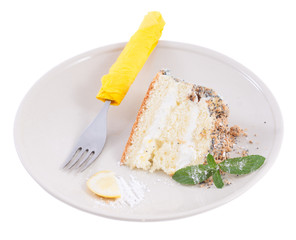 Piece of lemon cream cake with mint