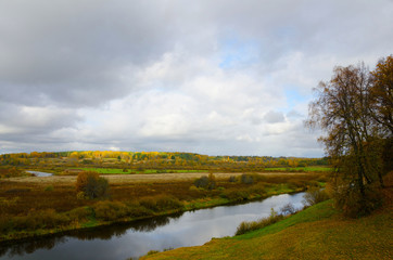 view to river with reflections  cloudy sky