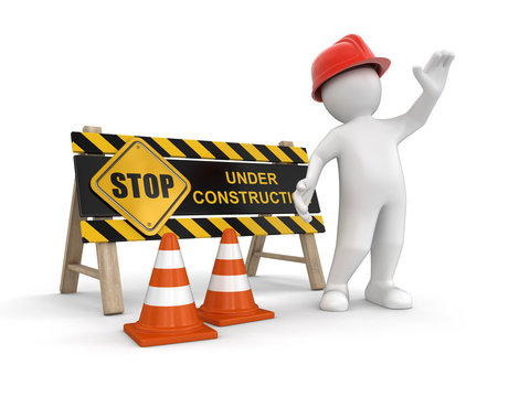 Under construction sign and worker. Image with clipping path