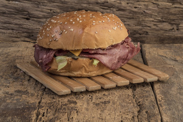 roast beef burger on wooden table