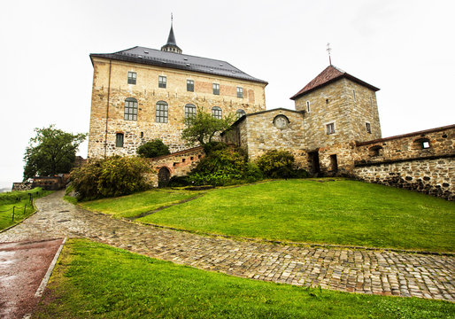 Akershus Fortress in rainy day. Oslo. Norway. Akershus Fortress is a medieval castle that was built to protect Oslo, the capital of Norway. It has also been used as a prison.