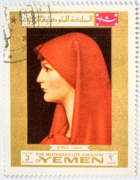 stamp printed in Yemen shows the painting of Saint Fabiola by Jean Jacques Henner
