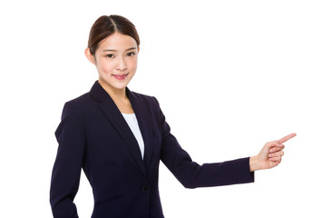 Asian young businesswoman with finger point aside