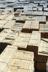 stacked piles of timber product