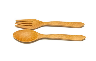 Spoon and fork made of wood on white background