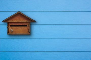Wooden mail box and shera plank wall blue, Vintage style.