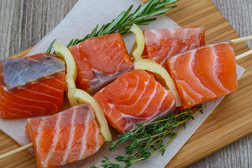 Raw salmon skewers