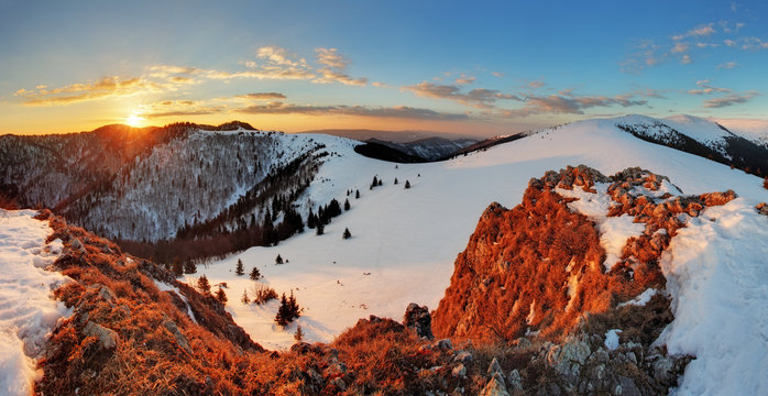 Landscape with sun and winter mountain