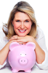 Elderly woman with piggy bank.