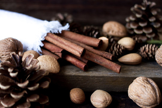 Christmas mood. cinnamon, walnuts and pine cone