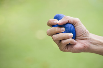 Woman hand squeezing a stress ball