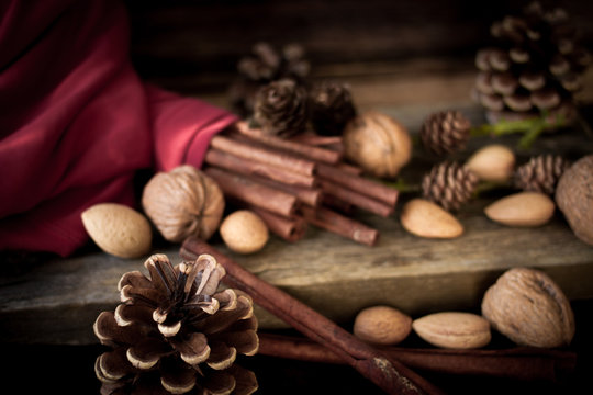 Christmas mood. cinnamon, walnuts and pine cone