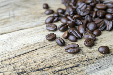 Coffee beans on wood background