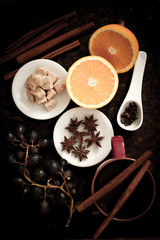 Fototapeta na wymiar ingredients for Christmas mulled wine, cinnamon, orange and grap