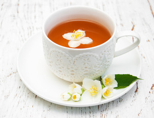 Cup of tea with jasmine flowers