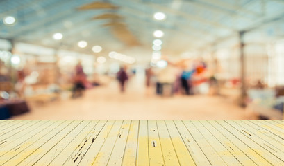 Blurred image of people walking at day market