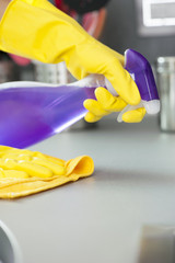 housekeeping cleaning furnitures in a kitchen