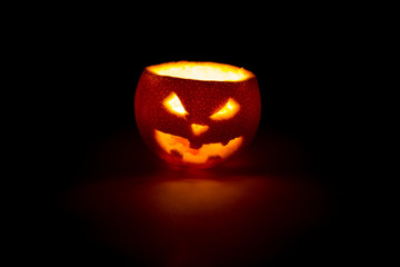 halloween orange fruit jack  lantern on dark