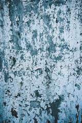 Old paint peeling from white door