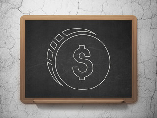 Money concept: Dollar Coin on chalkboard background