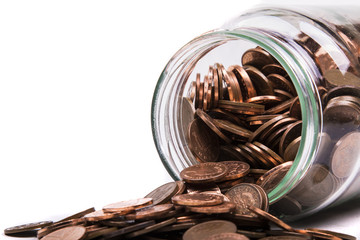 British Penny Coins Spilling From A jar