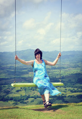 Woman swinging high